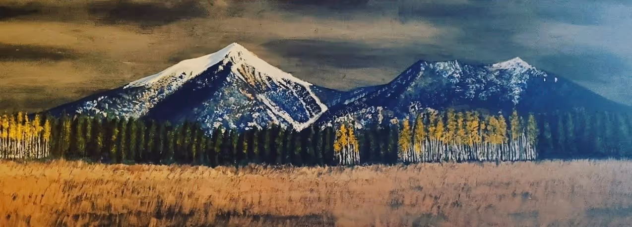 Wide acrylic painting of the snow-dusted San Francisco Peaks above Flagstaff, with a band of aspens and pines, a golden meadow foreground, and a bronze sky.