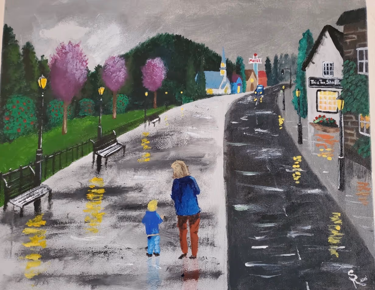 Acrylic painting of a rainy street at dusk with an adult and small child walking a wet reflective path, purple blossom trees, and a lit shopfront whose sign reads 'This too, shall pass.'